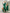 ELAGIA Emerald Silk Long Sleeve Maxi Dress modeled sitting pose - 3 piece women's suit versatile styling