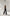 ELAGIA womens black suit jumpsuit product flat lay showing sleeveless V-neck design and tailored fit details